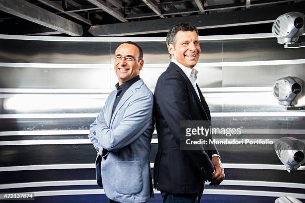 "The TV presenters Carlo Conti and Fabrizio Frizzi in the studios of the TV show L'eredit. Italy, 3rd April 2014 "