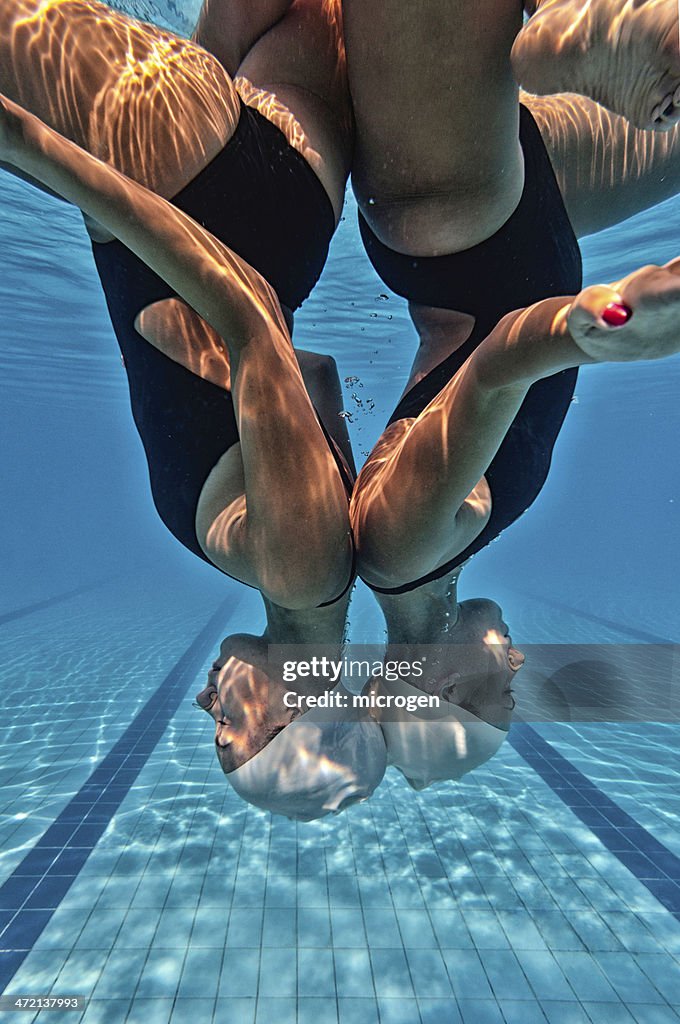 Synchronized swimmers upside down