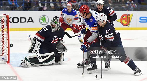 Goaltender Jack Campbell eyes a puck shot by Russia's Artyom Anisimov during the group B preliminary round ice hockey match Russia vs USA of the IIHF...