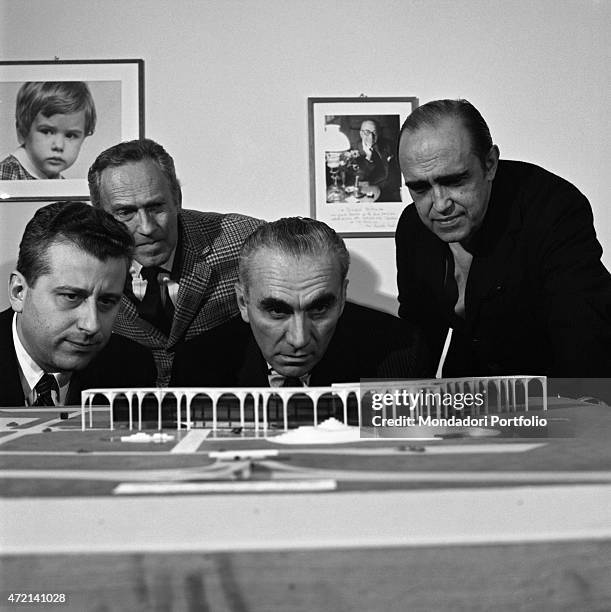 "Brazilian architect Oscar Niemeyer and Italian publisher Giorgio Mondadori seeing the Palazzo Mondadori scale model. The Italian publisher Giorgio...