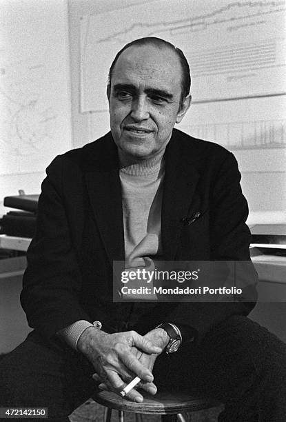 "Brazilian architect Oscar Niemeyer posing in his studio with a cigarette in his hand. The Italian publisher Giorgio Mondadori has recently...