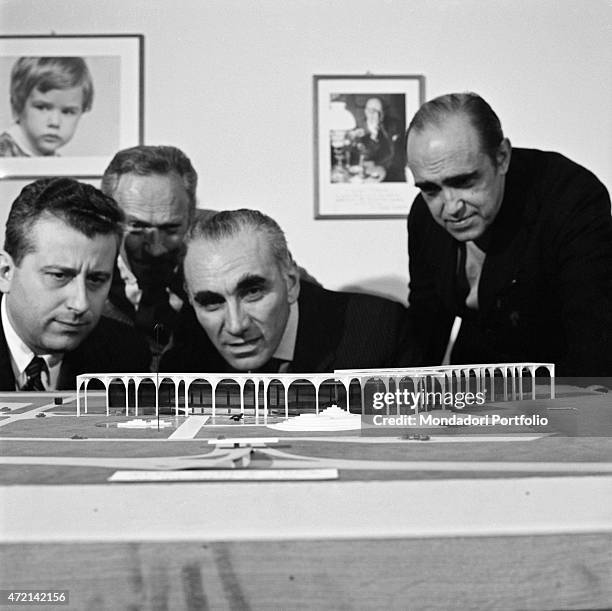 "Brazilian architect Oscar Niemeyer and Italian publisher Giorgio Mondadori seeing the Palazzo Mondadori scale model. The Italian publisher Giorgio...