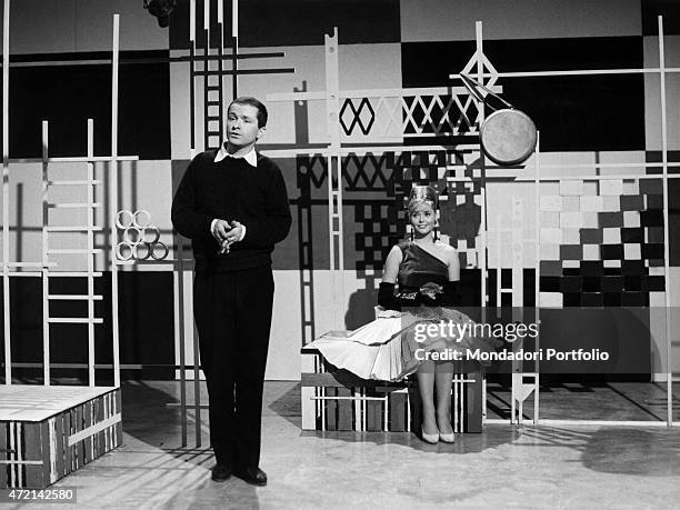 Italian singer-songwriter Gino Paoli performing the song Sassi during a TV show. 1960s