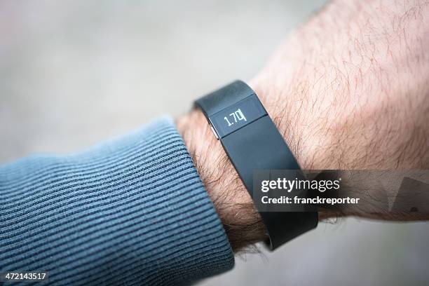 new fitbit force, sport fitness tracker - fitbit stock pictures, royalty-free photos & images