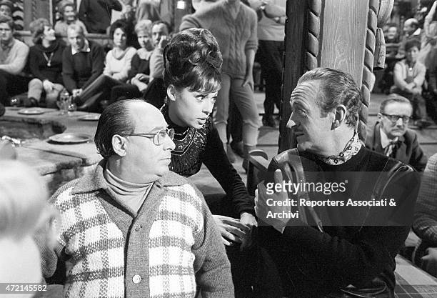 American actress Fran Jeffries and American actor David Niven during the shooting of the film 'The Pink Panther'. Cortina d'Ampezzo, 1963