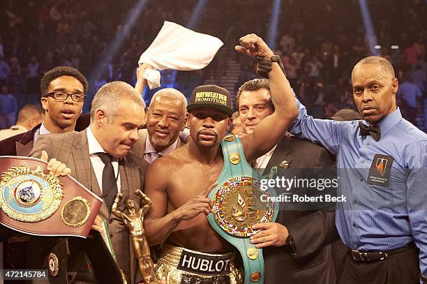 Super World / WBC / WBO Welterweight Title: Floyd Mayweather victorious with belts in ring after winning unified title bout vs Manny Pacquiao at MGM...