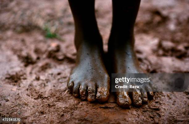 Kanague Camp, Lake Cyohoha, Rwanda. During the Rwandan Genocide, in a refugee camp, a Burundian Hutu man wanders around the tents.