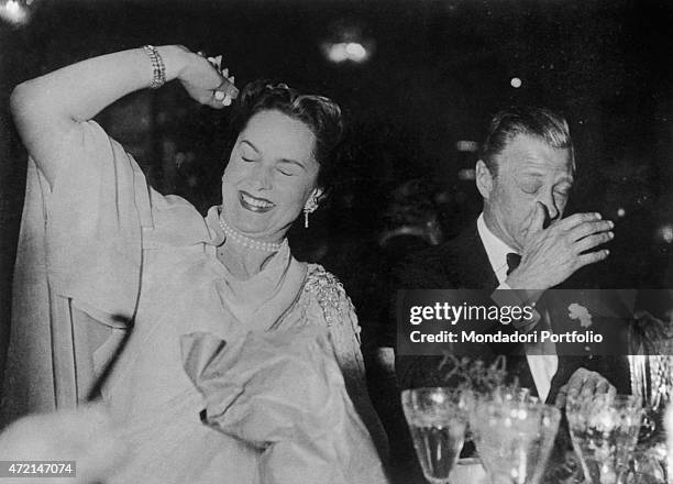 "French model Begum Om Habibeh Aga Khan , fourth wife of Imam of the Nizari Ismaili community Aga Khan III, having fun in a club beside Edward VIII....