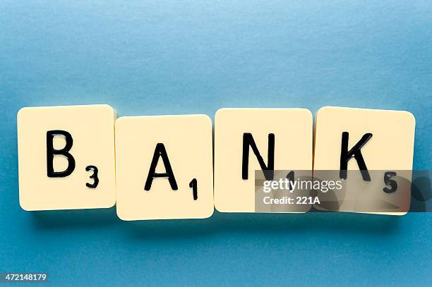 wort: bank (blau) - scrabble letters stock-fotos und bilder