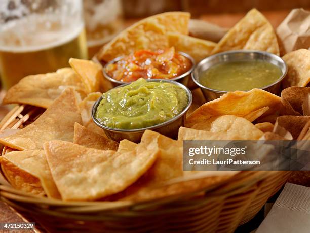 tortilla chips with salsa - nachos guacamole stock pictures, royalty-free photos & images