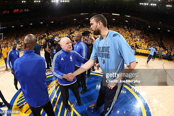Referee Joe Crawford shakes hands with Marc Gasol of the Memphis Grizzlies before the game against the Golden State Warriors in Game One of the...