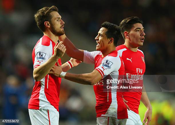 Aaron Ramsey of Arsenal celebrates with Alexis Sanchez and Hector Bellerin as he scores their second goal during the Barclays Premier League match...