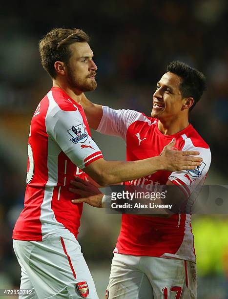 Aaron Ramsey of Arsenal celebrates with Alexis Sanchez as he scores their second goal during the Barclays Premier League match between Hull City and...