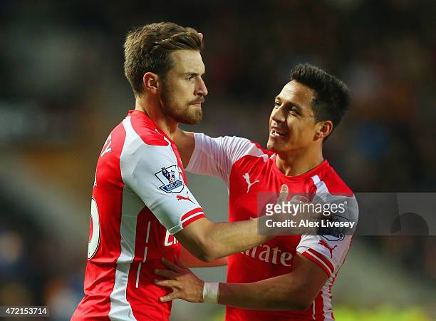 Aaron Ramsey of Arsenal celebrates with Alexis Sanchez as he scores their second goal during the Barclays Premier League match between Hull City and...