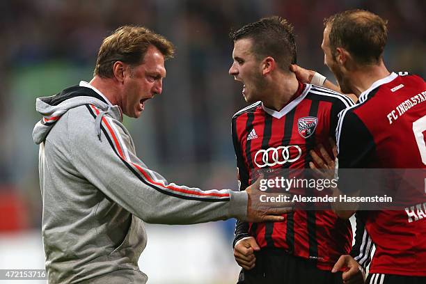 Pascal Gross of Ingolstadt celebrates scoring the opening goal with his head coach Ralph Hasenhuettl during the Second Bundesliga match between FC...