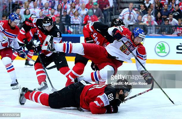 Brent Burns of Canada and Jakub Voracek of Czech Republic battle for the puck during the IIHF World Championship group A match between Canada and...
