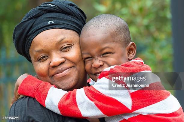 mother and son - haitian ethnicity stock pictures, royalty-free photos & images