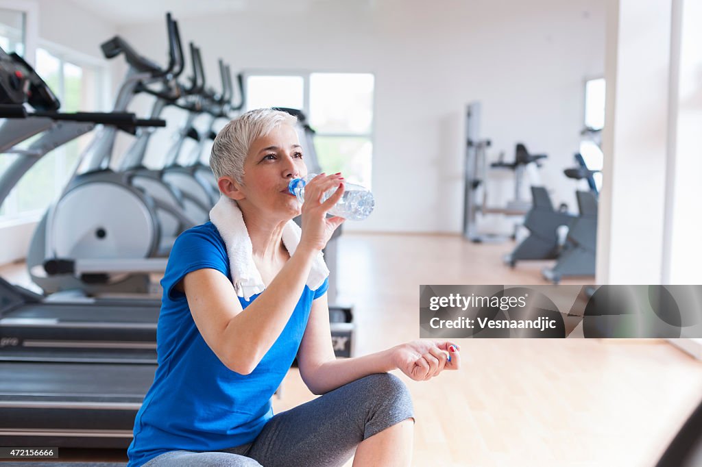 Mature woman relaxing after exercise