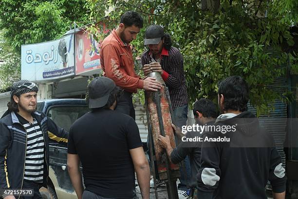 Members of Syrian opposition groups prepare to attack with cannons named "Hell and Fatah" against Assad Regime Forces headquarters in Amiriyah region...