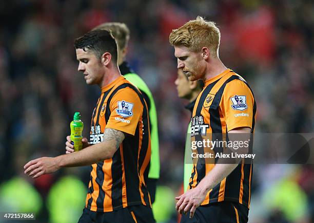 Robbie Brady and Paul McShane of Hull City look dejected in defeat after the Barclays Premier League match between Hull City and Arsenal at KC...