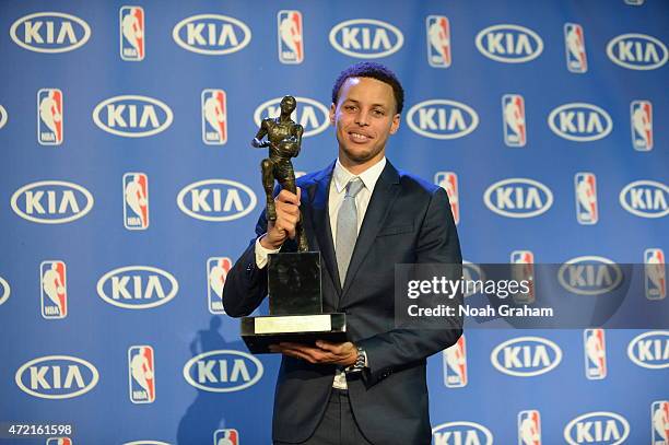 Stephen Curry of the Golden State Warriors holds the Maurice Podoloff Trophy during the KIA 2014-15 Most Valuable Player Award Press Conference on...