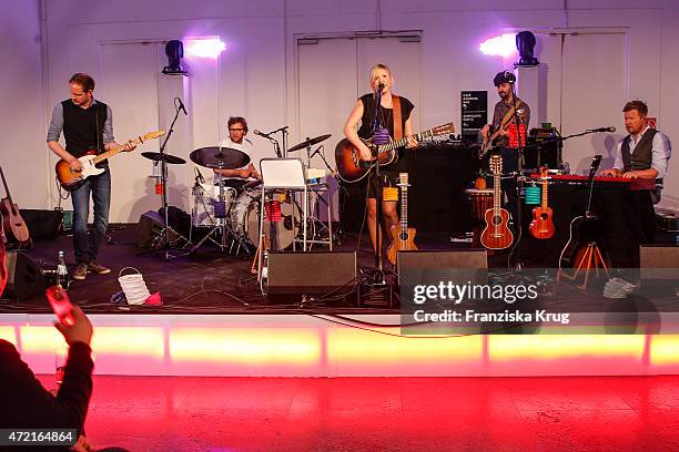 Claudia Korek and Band perform at the OTTO Exclusive Sport Cooperation celebrations on May 04, 2015 in Munich, Germany.