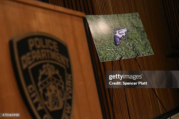 Photo of the suspect's weapon is viewed at a news conference at police headquarters with following the death of officer Brian Moore on May 4, 2015 in...