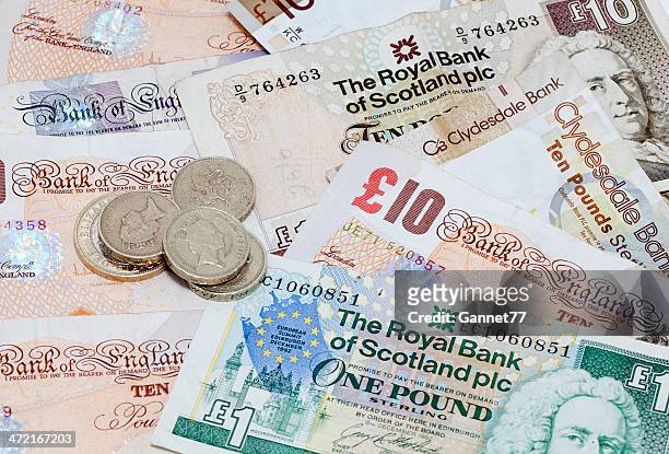 english and scottish currency background - two pound coin stock pictures, royalty-free photos & images