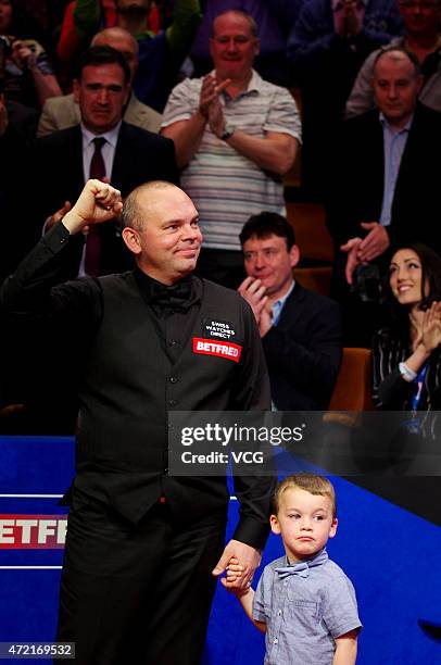 Stuart Bingham of England celebrates with his son after beating Shaun Murphy in the final of the 2015 Betfred World Snooker Championship at Crucible...