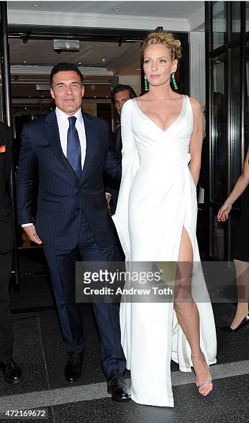 Andre Balazs and Uma Thurman depart The Mark Hotel for the Met Gala at the Metropolitan Museum of Art on May 4, 2015 in New York City.