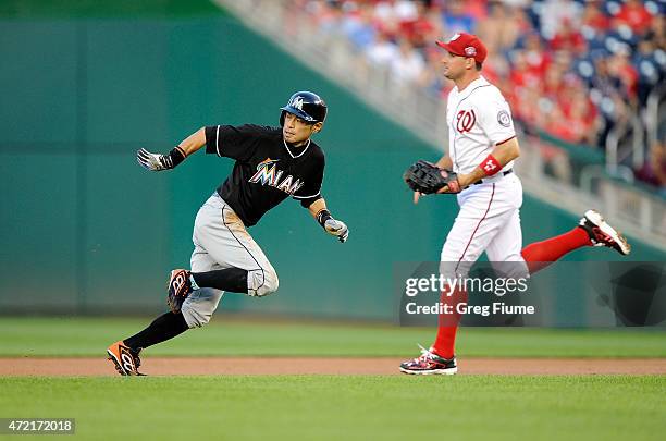 Ichiro Suzuki of the Miami Marlins gets caught in a run down in the second inning against the Washington Nationals at Nationals Park on May 4, 2015...