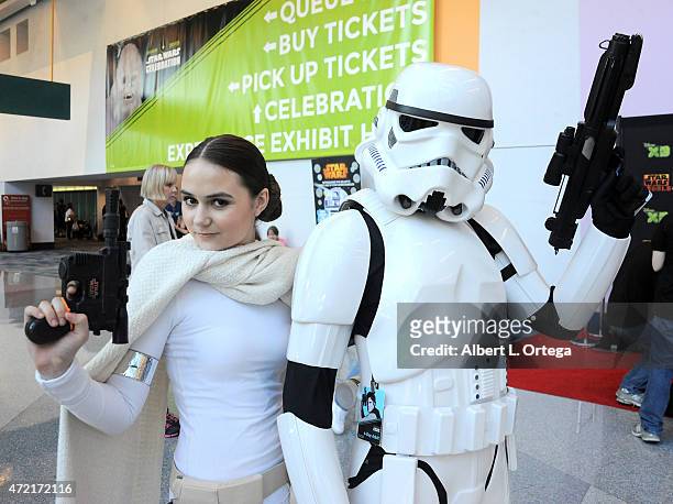 Cosplayer dressed as Queen Amidala from 'Attack of the Clones' with a Storm Trooper on Day Four of Disney's 2015 Star Wars Celebration held at the...