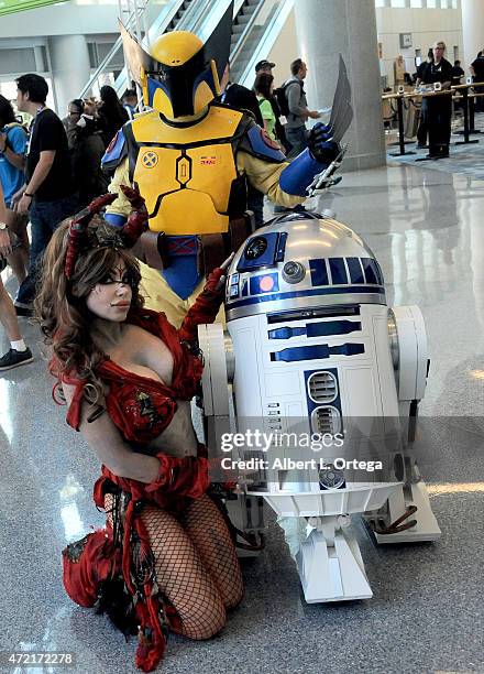 Actress/cosplayer Diana Terranova dressed as a Witch of Dathomir Nightsister with R2D2 and mashup of Wolverine and Boba Fett on Day Four of Disney's...