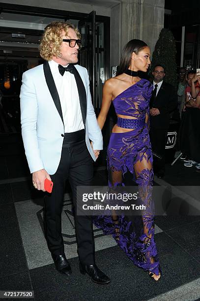 Peter Dundas and Joan Smalls depart The Mark Hotel for the Met Gala at the Metropolitan Museum of Art on May 4, 2015 in New York City.