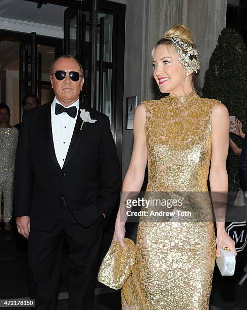 Michael Kors and Kate Hudson depart The Mark Hotel for the Met Gala at the Metropolitan Museum of Art on May 4, 2015 in New York City.