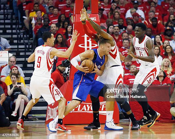 Blake Griffin of the Los Angeles Clippers battles for position with Pablo Prigioni, Josh Smith and Clint Capela of the Houston Rockets during Game...