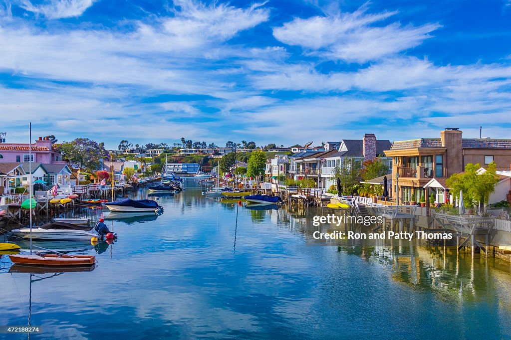 Beach houses and recreational boats at Newport Beach, CA (P)