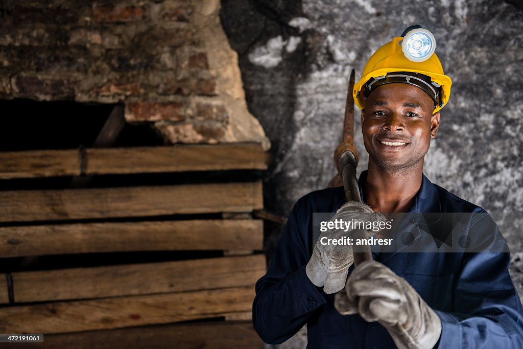 Miner holding a pick axe