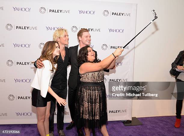 Actors Laura Marano, Ross Lynch, Calum Worthy and Raini Rodriguez take a group selfie at a special screening of Disney Channel's "Austin & Ally" as...
