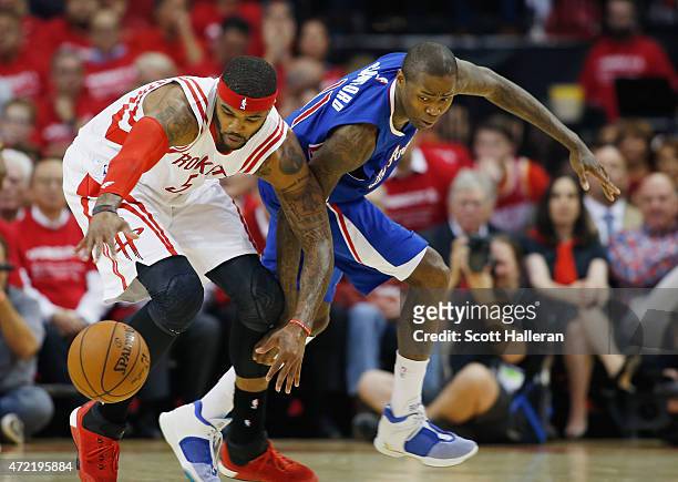 Josh Smith of the Houston Rockets battles for a loose basketball with Jamal Crawford of the Los Angeles Clippers during Game One in the Western...