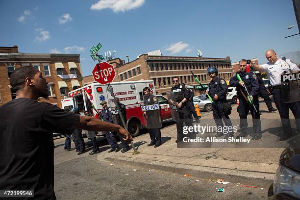 Man faces off with police on North Ave., near the site of recent riots and several blocks away from where Freddie Gray was arrested last month, May...