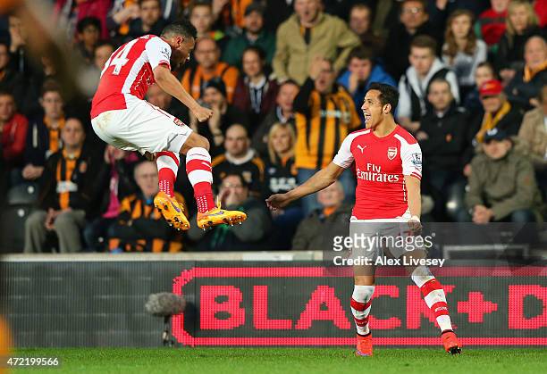 Alexis Sanchez of Arsenal celebrates with Francis Coquelin after scoring their first goal during the Barclays Premier League match between Hull City...
