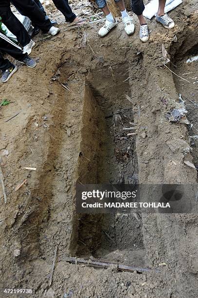 Thailand-Myanmar-Bangladesh-Malaysia-migration-minority,FOCUS by Jerome TAYLOR This picture taken on May 2, 2015 shows rescue workers and forensic...