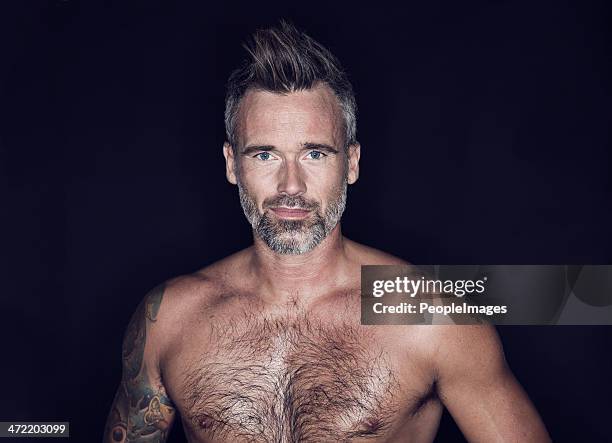 he's not a young man anymore...but you wouldn't say it! - hairy chest man stock pictures, royalty-free photos & images