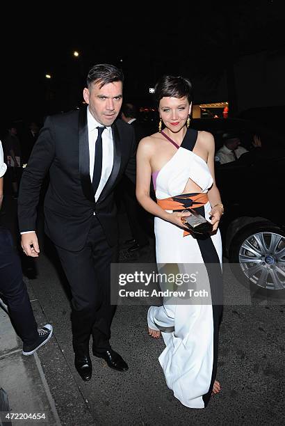 Roland Mouret and Maggie Gyllenhaal attend Michael Kors and iTunes After Party at The Mark Hotel on May 4, 2015 in New York City.