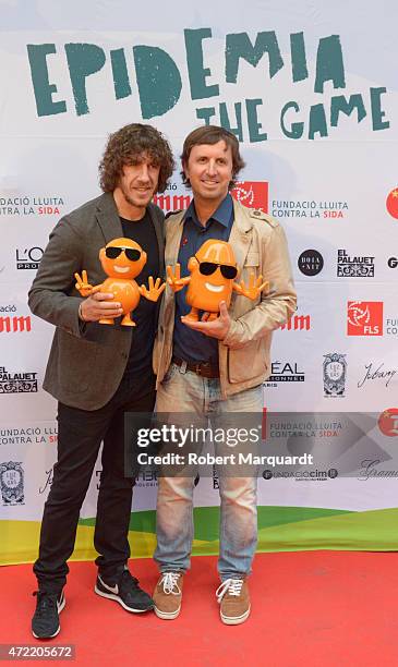 Carles Puyol and Jordi Rios attend a photocall for 'Epidemia The Game' presentation at the El Palauet on May 4, 2015 in Barcelona, Spain.