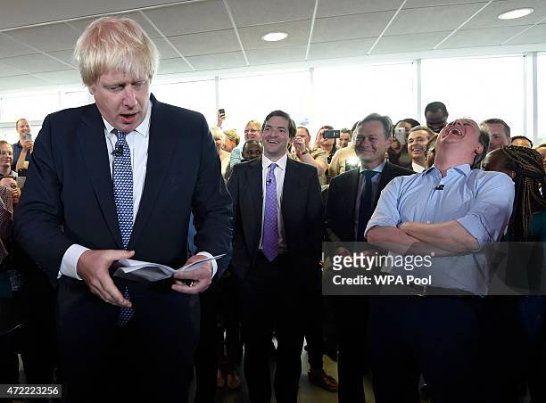 London Mayor Boris Johnson speaks as Prime Minister David Cameron looks on at an election rally in Hendon on May 5, 2015 in Twickenham, London....