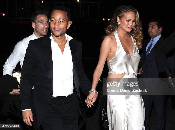 John Legend and Chrissy Teigan arrive at Rihanna's Private Met Gala After Party at Up & Down on May 4, 2015 in New York City.