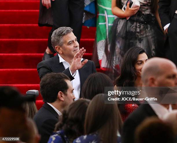 George Clooney and Amal Alamuddin leave the 'China: Through The Looking Glass' Costume Institute Benefit Gala at Metropolitan Museum of Art on May...