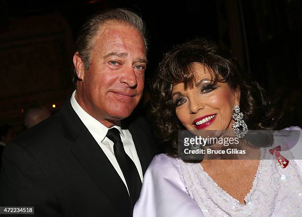 John James and Joan Collins pose at the Friars Club salute to Joan Collins at The Friars Club on May 4, 2015 in New York City.